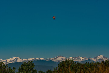 A Beautiful Hot Air Balloon Against Snowy Mountains