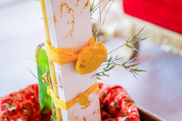 Indian Hindu wedding ceremony ritual items, decorations, hands close up