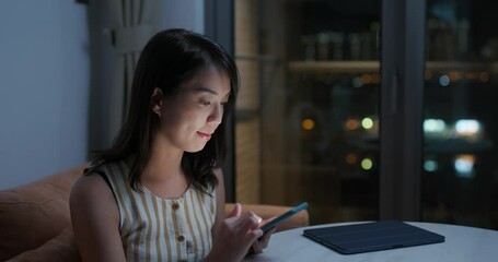 Poster - Woman watch on cellphone at home in evening