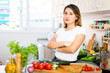 © JackF - Unhappy mexican housewoman crying during cooking in kitchen