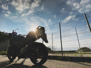 Wall Mural - Road black motorcycle on the road.