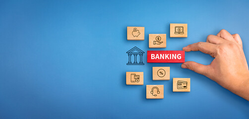 Wall Mural - hand holding a wooden block with text Banking with banking services icons. Banking concept, Banking background.