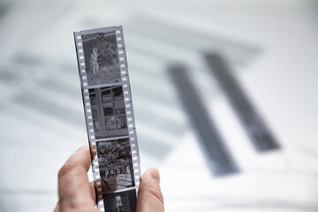 Film photography special  archival envelope slips for negative storage. 35mm and medium format photography. Film strips laying down on a table.