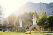 © luengo_ua - Yoga at park. Senior family couple exercising outdoors. Concept of healthy lifestyle.