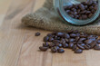 Close up of Roasted coffee beans on  wooden background with copy space.