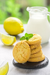 Wall Mural - Homemade freshly baked citrus cookies with lemon and white chocolate. Dessert for gourmets. Selective focus