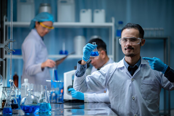 Wall Mural - medical science technology research in chemical laboratory, professional scientist working for experiment test in healthcare medicine work with glassware equipment and blue liquid