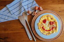 Omelette For A Child With A Smiley Face Out Of Ketchup