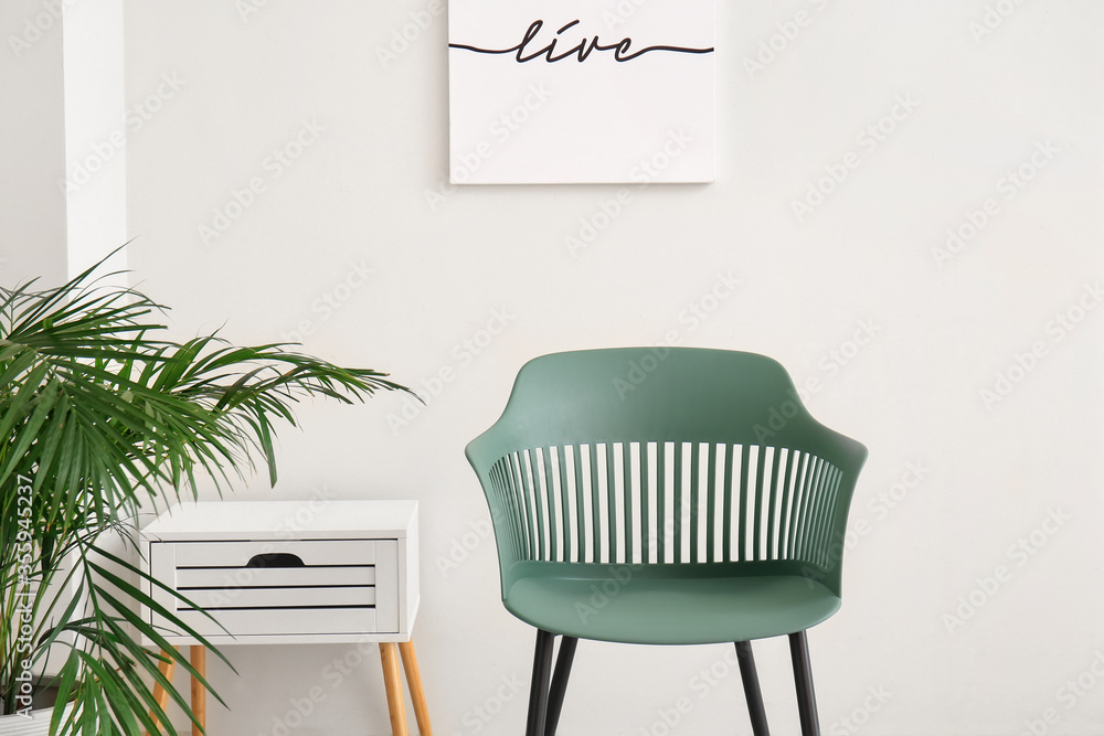 Interior of modern living room with chair - obrazy, fototapety, plakaty 