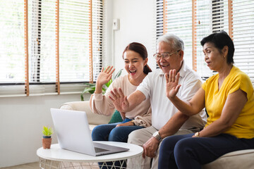 Wall Mural - Asian old senior video call virtual meeting with family