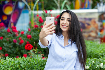 Wall Mural - business woman hand phone in selfie