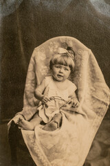 Wall Mural - Latvia - CIRCA 1930s: Portrait of baby girl in studio. Vintage archive Art Deco era photography