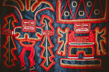 Texture Of South American Spellings On Fabric, With Red Designs