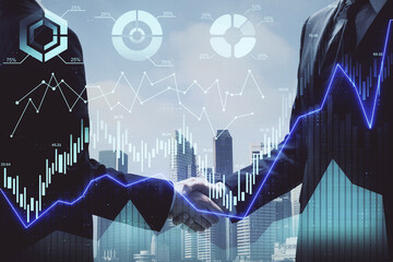 Double exposure of forex graph hologram and handshake of two men. Stock market concept.