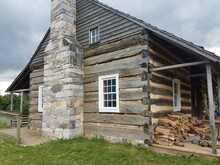 Wood Building Or Cabin With Firewood And Stone Chimney