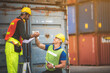 © chokniti - worker teamwork and partner of foreman, engineer, and businessman working in an international shipping area, concept of business industrial and working in container yard