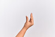 © Krakenimages.com - Hand of caucasian young woman picking and taking invisible thing, holding object with fingers showing space