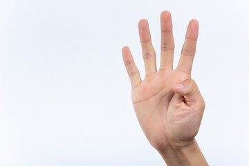 Closeup of isolated on green adult female hand counting from 0 to 5. Woman shows fist fist, then one, two, three, four, five fingers. Manicured nails painted with beautiful pink polish. Math concept.