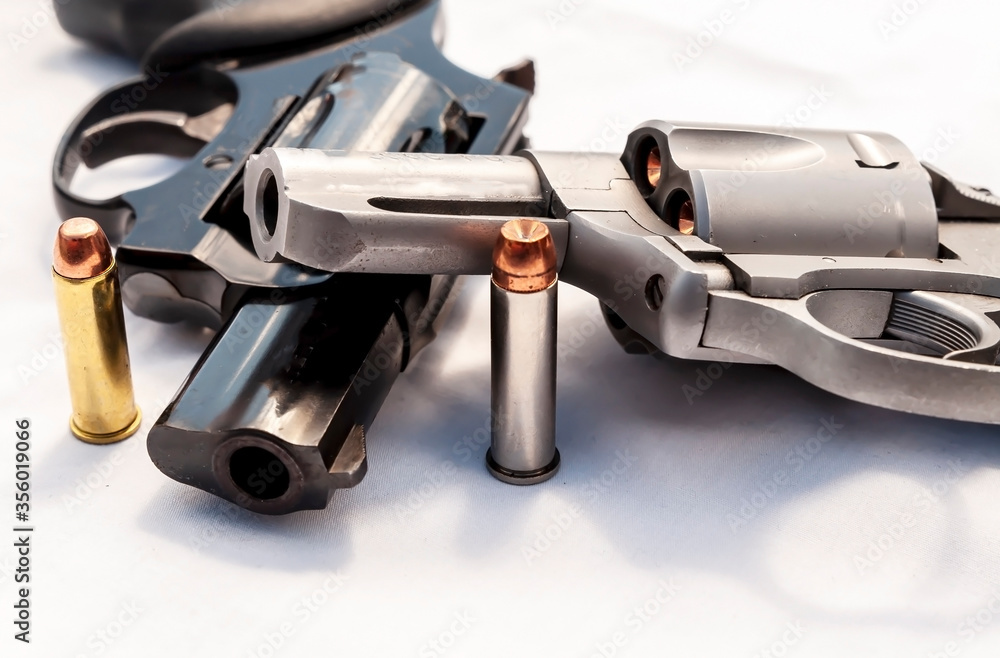 ภาพถ่าย Stock Two revolvers, a 357 magnum and a 38 special with hollow ...