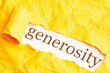 the word generosity is seen from under torn orange paper with ragged edges