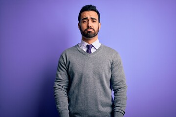 Sticker - Handsome businessman with beard wearing casual tie standing over purple background depressed and worry for distress, crying angry and afraid. Sad expression.