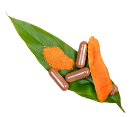 Wall Mural - Turmeric Root Powder, Curcuma Root, Turmeric Capsule on Leaf; white background.Herb high vitamin C.