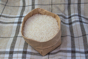 Canvas Print - rice on a wooden table