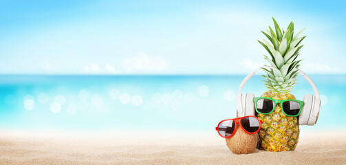 Aufkleber - Pineapple with sunglasses and headphones on hot sand beach