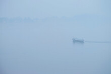 A Boat On The Mekong River In The Foggy Morning In Chiang Khan, Loei Province