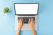 © One Pixel Studio - Female hands using laptop with empty screen on blue table. Business background. Flat lay