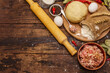 © FuzullHanum - Fresh raw ingredients for the preparation of dumplings, ravioli, savory pies, quiche. Stuffing, flour, dough, eggs, spices