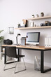 © New Africa - Modern computer on table in office interior. Stylish workplace