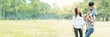 © khwanchai - Happy young family spending time together outside in green nature and park, vacation of parents concept