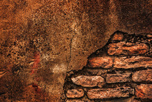 Background Of Rusty-burn Colored Old Brick Wall With Flaking Off Plaster.