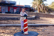 © Angelov - cute little girl holding a ship steering wheel in an amusement park