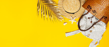 Beach Wicker Straw Or Rattan Women's Eco Bag White Dress Straw Hat Golden Tropical Leaf Shells Starfish On Yellow Background. Flat Lay Top View. Concept Of Travel Summer Background. Beach Accessories