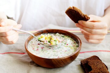 Canvas Print - okroshka - Russian cold soup and hands. Space for text. copy space