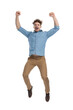 © Viorel Sima - excited young casual guy in denim shirt jumping and celebrating