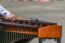 A Street Musician Plays Marimba. The Guy Hands Plays On The Marimba On The Street.