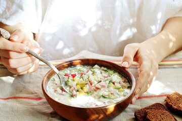 Poster - okroshka - Russian cold soup and hands. Space for text. copy space