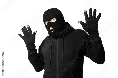 Cuadros en Lienzo Arrested masked thief with raised arms isolated over white wall