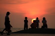 © kaesunza - silhouette of a people on the beach at sunrise