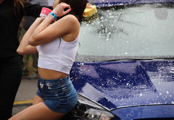 Wall Mural - Wet Girl With Car Sponge Washing A Vehicle  