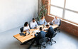 © Prostock-studio - Diverse Colleagues Working Sitting Together In Modern Office, High-Angle Shot