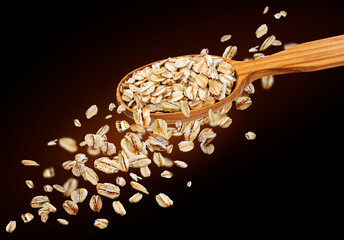 Canvas Print - Falling oat flakes isolated on black background