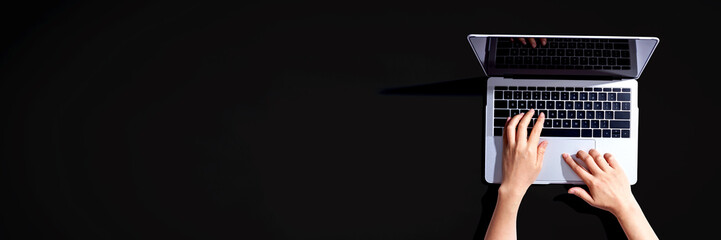 Wall Mural - person using a laptop computer from above