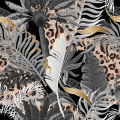  Seamless leopard skin pattern with tropical leaves. Vector.