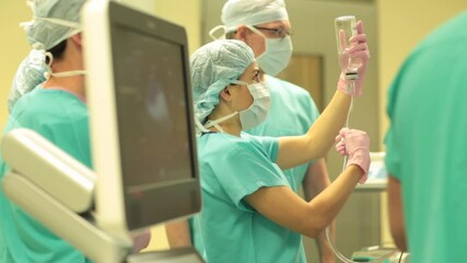 Wall Mural - Assistant helps the surgeon during the operation