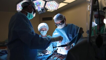 Wall Mural - Surgeons in the operating room with a patient