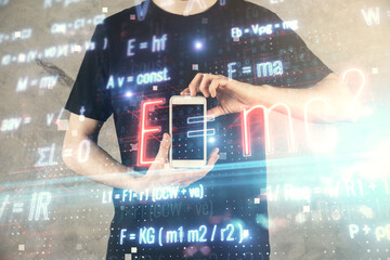 Double exposure of man's hands holding and using a phone and formulas drawing. Education concept.